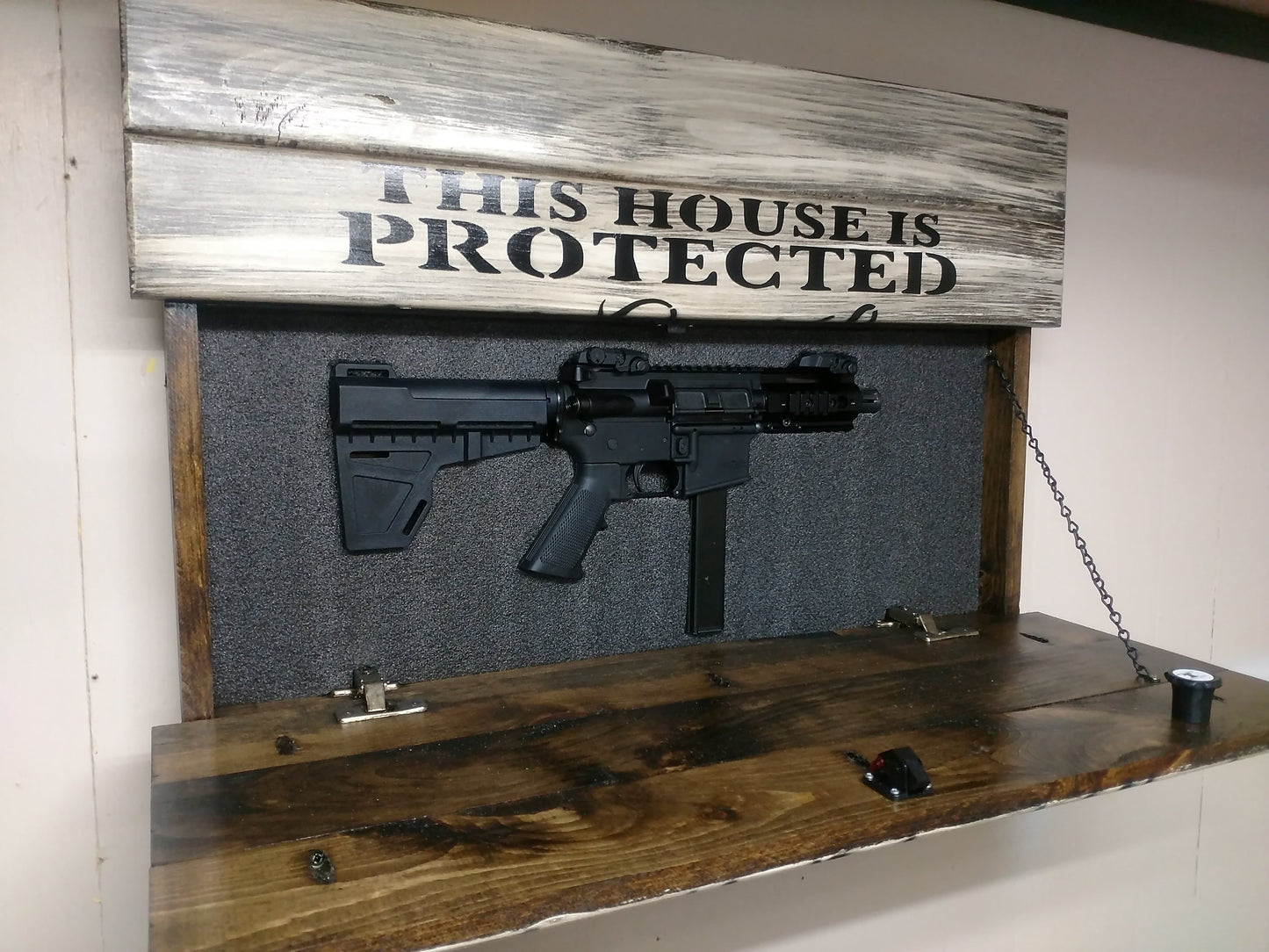 This House is Protected Hidden Gun Storage Sign